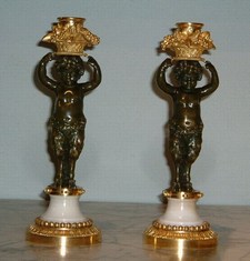 Pair of Louis XVI bronze and ormolu candlesticks.