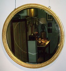 Early 19th century carved giltwood circular mirror.