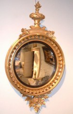 Fine Regency carved giltwood convex mirror