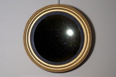 A Large Regency Giltwood Convex Mirror